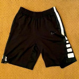 Nike, medium athletic shorts. Color is black.